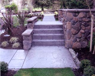 Three concrete walls were cast at the Sloan house to add structural support and to carry the stairs needed to reach the front door, which is 5 feet above the finished grade. Photo courtesy of Greater Seattle Concrete
