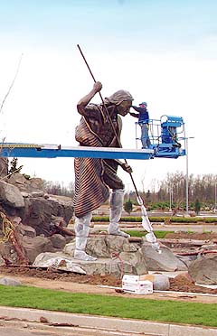  20-foot bronze spear fisherman 